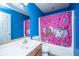 Blue bathroom with sink vanity, pink shower curtain, toilet, and mirror at 3033 Kinswood Ln, Ladson, SC 29456