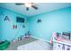 Bright blue bedroom with a ceiling fan and plush rug at 3033 Kinswood Ln, Ladson, SC 29456