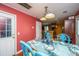 Cozy dining room with blue dining set, light fixture and entry to kitchen at 3033 Kinswood Ln, Ladson, SC 29456