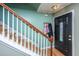 Entryway with hardwood floors, wood staircase, and inviting front door at 3033 Kinswood Ln, Ladson, SC 29456