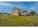 Charming two-story home with neutral siding, landscaped yard, and a welcoming front porch at 3033 Kinswood Ln, Ladson, SC 29456