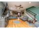 Spacious living room with hardwood floors, ceiling fan, and staircase at 3033 Kinswood Ln, Ladson, SC 29456
