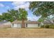 View of the backyard featuring mature trees and a wooden fence at 315 Indigo Rd, Goose Creek, SC 29445