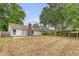 View of the backyard with a patio and mature trees providing shade at 315 Indigo Rd, Goose Creek, SC 29445