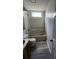 This cozy bathroom offers a tub with shower, vinyl floors, and natural light from the window at 315 Indigo Rd, Goose Creek, SC 29445