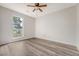 Light-filled bedroom features wood-look floors and large window overlooking the front yard at 315 Indigo Rd, Goose Creek, SC 29445
