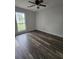 Bedroom featuring new flooring, fresh paint, ceiling fan, and large windows at 315 Indigo Rd, Goose Creek, SC 29445
