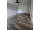 Bright bedroom featuring new flooring, fresh paint, ceiling fan, and multiple closets for ample storage space at 315 Indigo Rd, Goose Creek, SC 29445