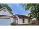 Charming one-story home with attached garage, well-maintained lawn, and inviting curb appeal in a quiet neighborhood at 315 Indigo Rd, Goose Creek, SC 29445