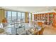 Spacious living room features large windows with water views and built in bookshelves at 330 Concord St # 15C, Charleston, SC 29401