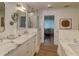 Elegant bathroom featuring marble countertops, double sinks, and a glass-enclosed shower at 330 Concord St # Th 21, Charleston, SC 29401