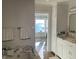 Bathroom with a soaking tub, marble countertops, and a scenic ocean view at 330 Concord St # Th 21, Charleston, SC 29401