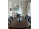 Elegant dining room with a large wood table, chandelier, and stylish decor at 330 Concord St # Th 21, Charleston, SC 29401