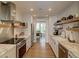 Modern kitchen boasts stone counters, stainless appliances, and open shelving at 330 Concord St # Th 21, Charleston, SC 29401