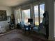 Bright living room with waterfront views, cozy seating, and natural light at 330 Concord St # Th 21, Charleston, SC 29401
