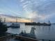 Scenic waterfront view showcasing a bridge, boats, and a picturesque sky, highlighting the property's stunning location at 330 Concord St # Th 21, Charleston, SC 29401