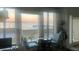 Bright room with waterfront views from large windows, cozy seating, and natural light at 330 Concord St # Th 21, Charleston, SC 29401