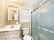 Cozy bathroom featuring a white sink and cabinet, a toilet, and a shower with glass doors at 330 Crestwood Dr, Moncks Corner, SC 29461