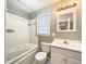 Bright bathroom featuring a jacuzzi tub, a clean white toilet, and updated sink at 330 Crestwood Dr, Moncks Corner, SC 29461