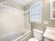 Relaxing bathroom featuring a tub with jacuzzi jets, clean white fixtures and natural lighting at 330 Crestwood Dr, Moncks Corner, SC 29461