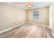 Neutral bedroom featuring new flooring, a ceiling fan, and a bright window at 330 Crestwood Dr, Moncks Corner, SC 29461