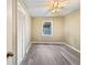 Clean, well-lit bedroom with neutral walls, modern flooring, and a window for natural light at 330 Crestwood Dr, Moncks Corner, SC 29461