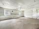 Spacious garage with windows and unfinished walls, offering potential for customization and ample storage space at 330 Crestwood Dr, Moncks Corner, SC 29461