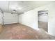 Clean garage features a single car parking space with white walls, side door, and overhead lighting at 330 Crestwood Dr, Moncks Corner, SC 29461