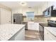 Charming kitchen featuring white cabinets, stainless steel appliances, and beautiful granite countertops at 330 Crestwood Dr, Moncks Corner, SC 29461