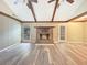 Bright living room featuring brick fireplace, new luxury vinyl plank flooring, and exterior access at 330 Crestwood Dr, Moncks Corner, SC 29461