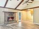 Cozy living room featuring a charming brick fireplace, new luxury vinyl plank flooring, and plenty of space at 330 Crestwood Dr, Moncks Corner, SC 29461