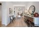 Spacious foyer featuring light wood floors, bench seating, wainscoting, and stylish decor at 332 Fish Creek Ct, Summerville, SC 29486