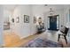 Bright foyer featuring light wood floors, stylish decor, and a clear view to the front door at 332 Fish Creek Ct, Summerville, SC 29486