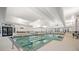Bright indoor pool area showcasing a large pool, comfortable lounge chairs, and well-maintained facilities at 332 Fish Creek Ct, Summerville, SC 29486