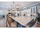 Bright kitchen boasts an expansive island, pendant lighting, and stainless steel appliances at 332 Fish Creek Ct, Summerville, SC 29486