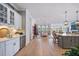 Modern kitchen with a wine cooler, stainless steel faucet and ample cabinet space, open to the dining and living area at 332 Fish Creek Ct, Summerville, SC 29486