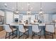 This expansive kitchen boasts an island with seating and a full complement of stainless appliances at 332 Fish Creek Ct, Summerville, SC 29486