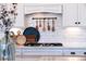 Gas cooktop and decorative elements create an elegant and functional kitchen space at 332 Fish Creek Ct, Summerville, SC 29486