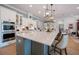 This expansive kitchen boasts an island with seating and a full complement of stainless appliances at 332 Fish Creek Ct, Summerville, SC 29486