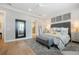 Serene bedroom with hardwood floors, tufted headboard, and en-suite bathroom access at 332 Fish Creek Ct, Summerville, SC 29486