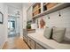 Beautiful mudroom with bench seating, stylish shiplap, storage and decor, offering function and style at 332 Fish Creek Ct, Summerville, SC 29486