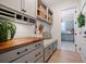 Charming mudroom with built-in bench, storage cabinets, and shiplap accent wall at 332 Fish Creek Ct, Summerville, SC 29486