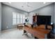 Modern home office with abundant natural light, a sleek desk, and contemporary furnishings at 332 Fish Creek Ct, Summerville, SC 29486