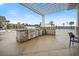 Outdoor kitchen featuring a built-in grill and counterspace near the pool with convenient seating for dining at 332 Fish Creek Ct, Summerville, SC 29486
