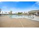 Expansive pool area with clear blue water, plenty of lounge chairs, and lush tropical landscaping at 332 Fish Creek Ct, Summerville, SC 29486