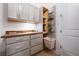 Laundry room with gray cabinets, butcher block countertop, and slide out hamper at 332 Fish Creek Ct, Summerville, SC 29486