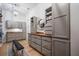 Spacious walk-in closet featuring custom shelving, drawers, and wood floors at 332 Fish Creek Ct, Summerville, SC 29486