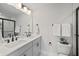Contemporary bathroom with dual sinks, modern fixtures, and a glass-enclosed shower at 333 Bremerton Dr, Goose Creek, SC 29445
