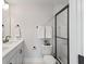 Modern bathroom with a double sink vanity, black hardware, and a glass-enclosed shower with marble tile at 333 Bremerton Dr, Goose Creek, SC 29445