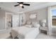 Serene bedroom with a ceiling fan, plush carpet, and an ensuite bathroom with modern fixtures at 333 Bremerton Dr, Goose Creek, SC 29445